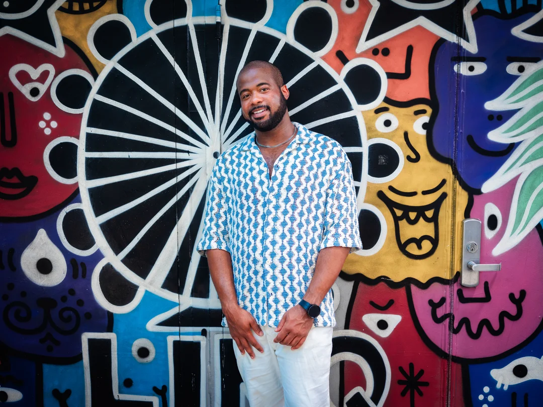 Ringba User Stories - Michael Walker in front of grafiti wall art
